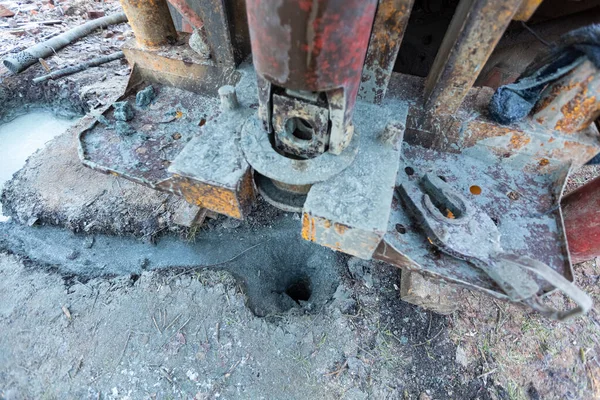 Well made by hydraulic ground water hole drilling machine installed on the old truck with big wheels on the construction site. Groundwater well drilling. — Stock Photo, Image