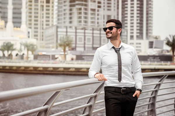 Businessman on river shore — Stock Photo, Image