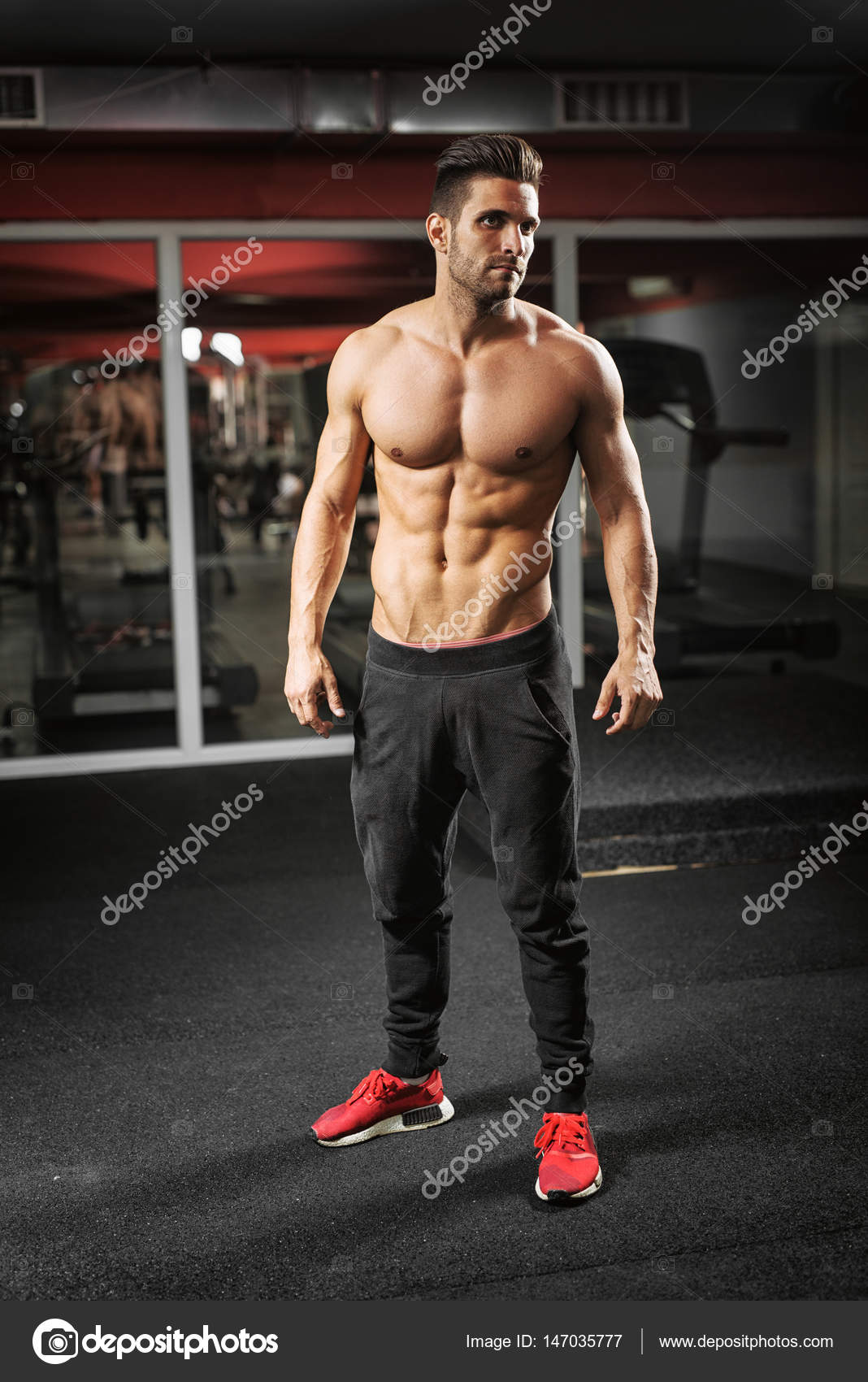 Fit man working out at gym Stock Photo by ©dusanpetkovic 147035777