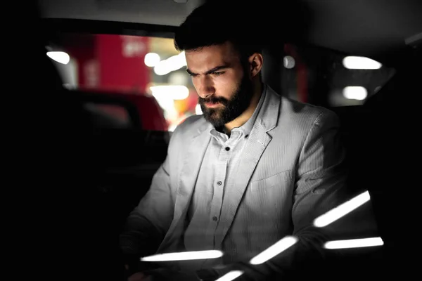 Businessman working in car — Stock Photo, Image