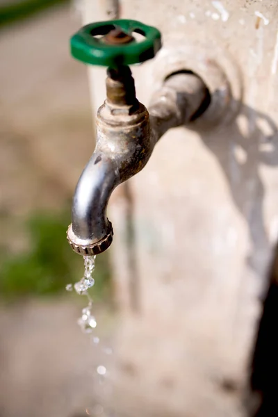 Water dripping from faucet — Stock Photo, Image