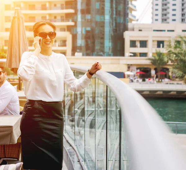 Businesswoman talking by smartphone — Stock Photo, Image