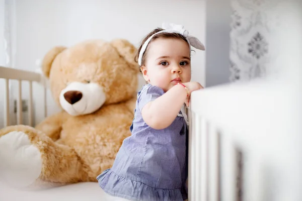 Cute toddler in her crib — Stock Photo, Image