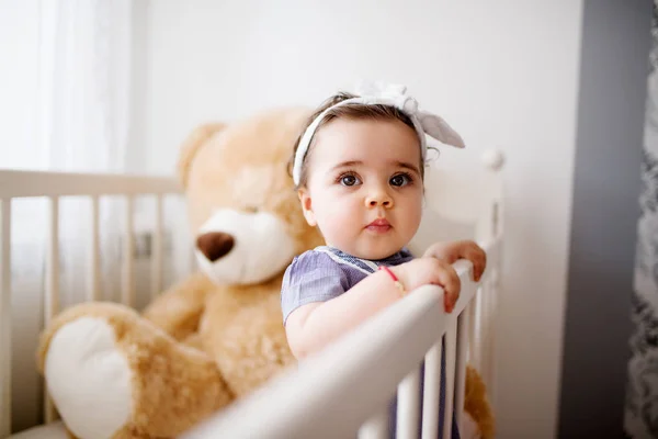 Cute toddler in her crib — Stock Photo, Image