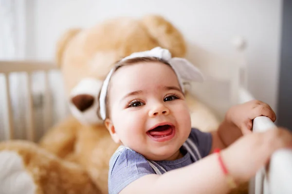 Cute toddler in her crib — Stock Photo, Image