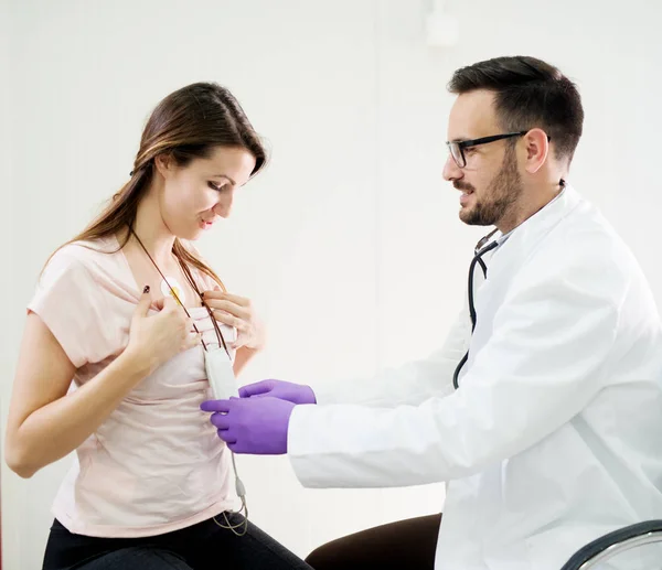 Pretty Young Woman Wearing Holter Monitor Device While Doctor Checking — Stock Photo, Image