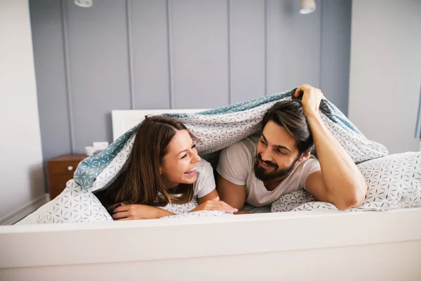 Couple in pajamas bedroom — Stock Photo, Image