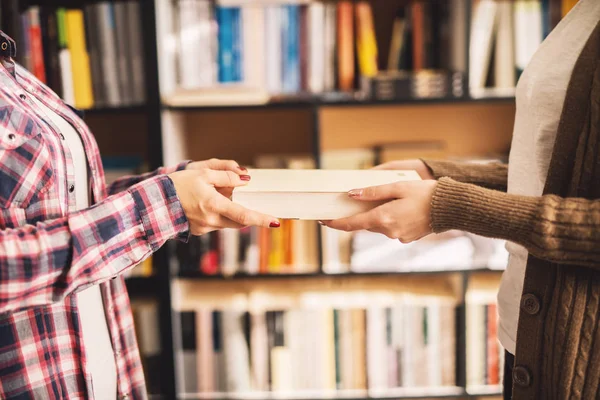 Woman Giving Book Another Woman Library — Stock Photo, Image