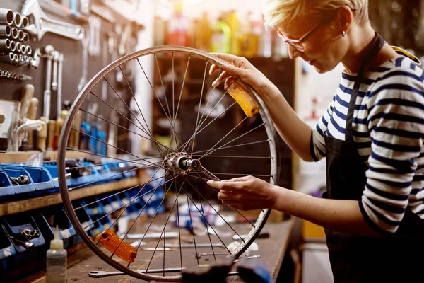 Beautiful Focused Woman Checking Bicycle Tire Wrench Garage — Stock Photo, Image
