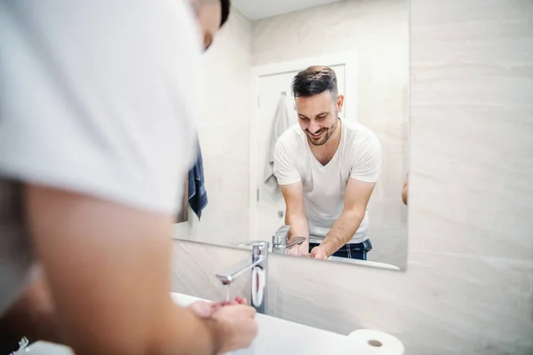Reflection Handsome Caucasian Man Standing Bathroom Cupped Hands Washing Himself — Stock Photo, Image