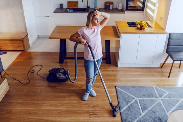 Tried Worthy Caucasian Blond Woman Standing Living Room Wiping Sweat — Stok fotoğraf