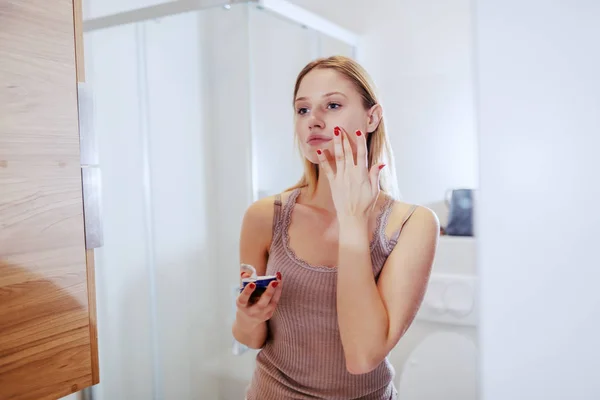 Young Attractive Caucasian Blond Woman Standing Front Mirror Bathroom Applying — 스톡 사진