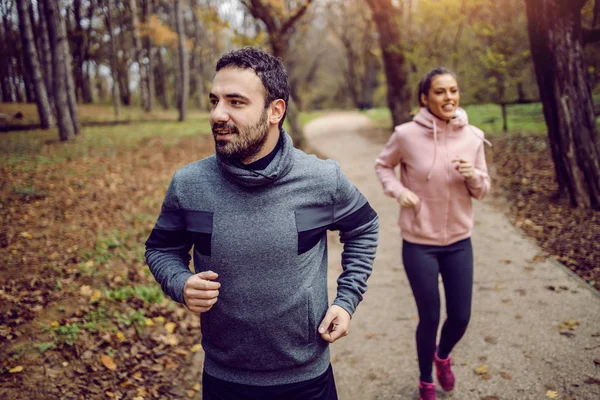 Positive Caucasian Bearded Sportsman Running Nature His Girlfriend — 스톡 사진