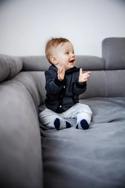 Cheerful Adorable Laughing Little Boy Clapping His Hands Sitting Sofa — Stock Photo, Image