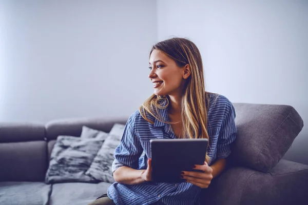 Young Charming Smiling Caucasian Brunette Stripped Shirt Sitting Sofa Living — Stock Photo, Image