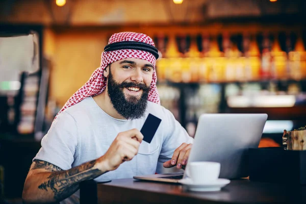 Young Smiling Attractive Positive Bearded Tattooed Muslim Guy Sitting Cafe — Stock Photo, Image