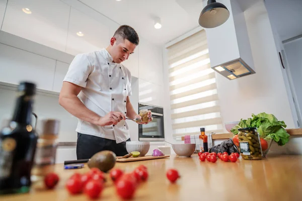 Low Angle View Focused Caucasian Chef Uniform Standing Kitchen Adding — Stockfoto