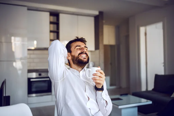 Young Smiling Attractive Bearded Man Sitting Home Holding Mug Fresh — 图库照片