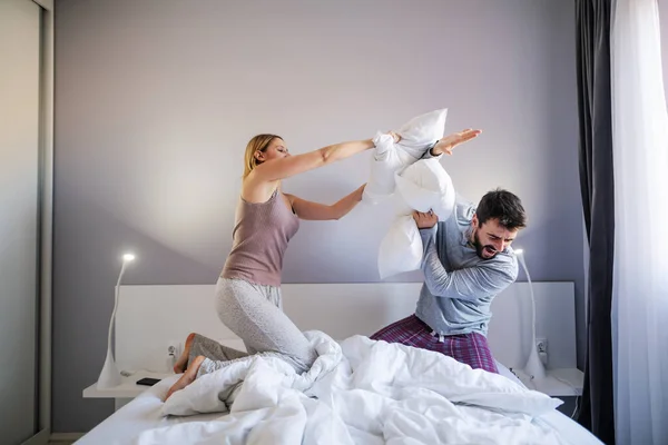Young Playful Couple Having Pillow Fight Morning Bedroom — ストック写真