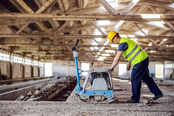 Full Length Construction Worker Using Machine — Stock Photo, Image