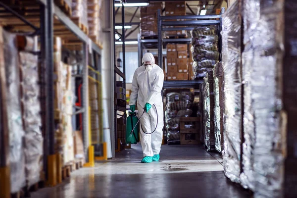 Man Protective Suit Mask Disinfecting Warehouse Full Food Products Corona — Stock Photo, Image