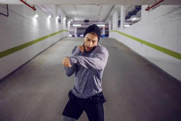 Young Muscular Sportsman Sparring Underground Garage — Stok fotoğraf