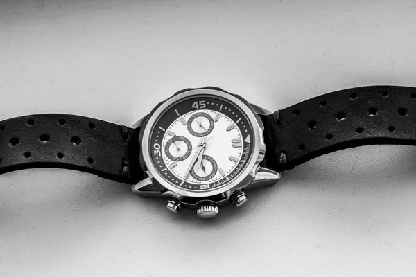 Black and white wrist man watch showing time