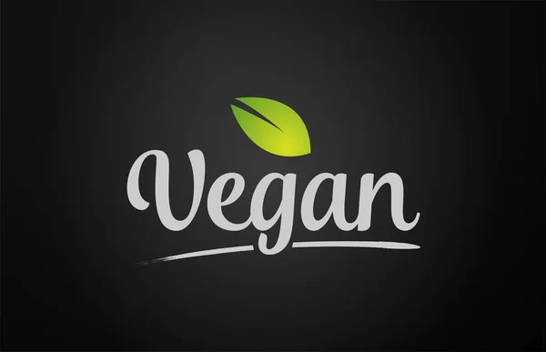 Hoja verde sobre fondo negro texto vegano palabra escrita a mano para — Vector de stock