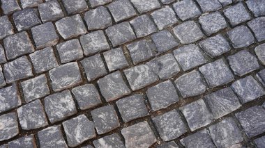 Sokak graniti kaldırım taşı küp taşı. Duvar kağıdını kapat.