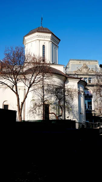 Classical Romanian orthodox church or monastery with trees — Stock Photo, Image