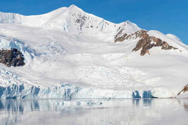 Antarctic landscape with glacier and mountains