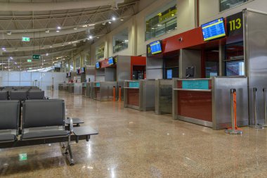 Passenger seats in Departure lounge in airport terminal, travel concept