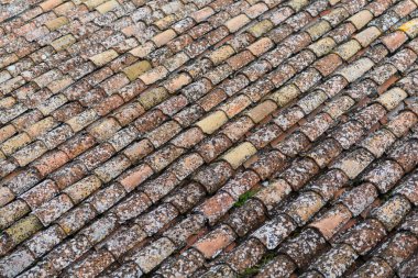 Old red tiled roof on the european house