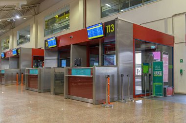 Passenger seats in Departure lounge in airport terminal, travel concept