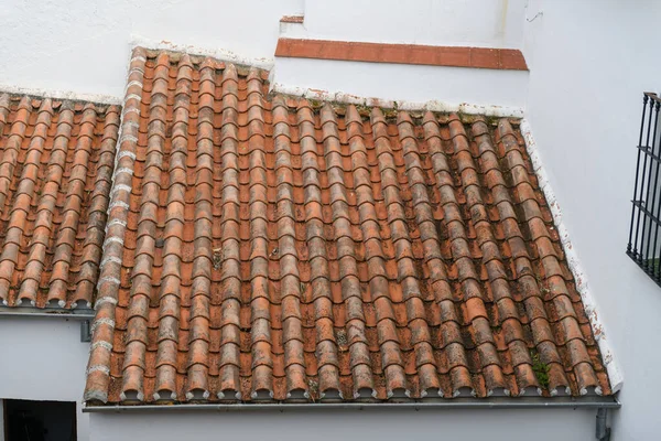 Old red tiled roof on the european house