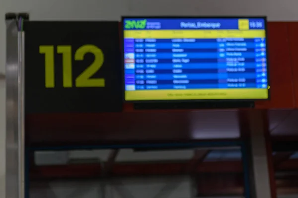 Electronic departures and arrivals board blured