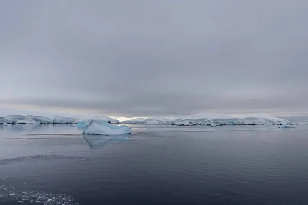 Antarctic landscape with iceberg, view from expedition ship