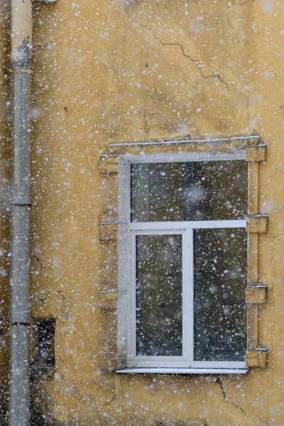 old building in winter in snowfall