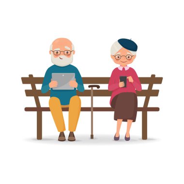 Gadget'lar ile bir bankta oturan yaşlı çift