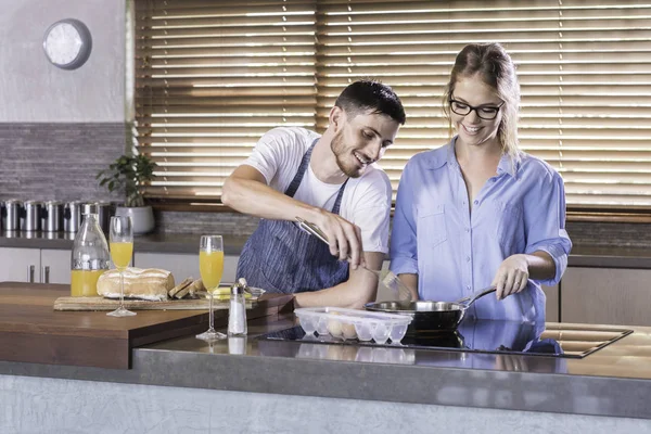 breakfast preparation  kitchen cooking happy young couple