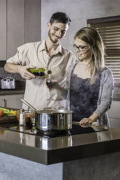 Dinner preparation  kitchen cooking happy young couple — Stock Photo, Image