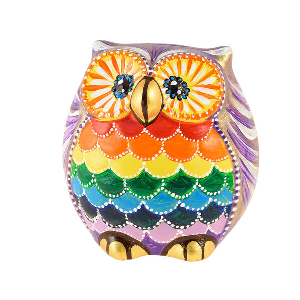 A clay figurine of an owl painted in bright colors