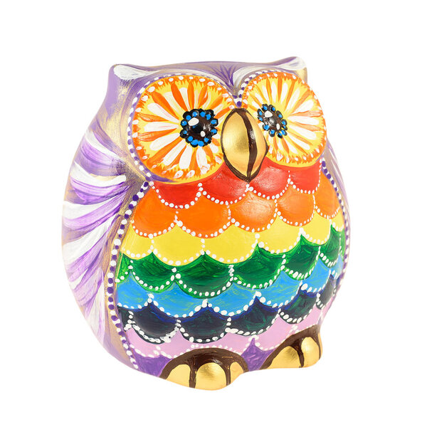 A clay figurine of an owl painted in bright colors