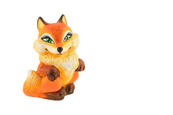 Uma estatueta de barro de uma raposa lindamente colorida — Fotografia de Stock