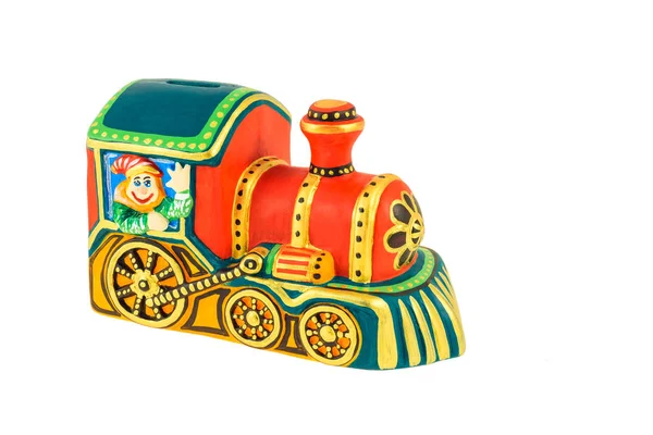 Una locomotora de juguete pintada en colores brillantes Fotos De Stock