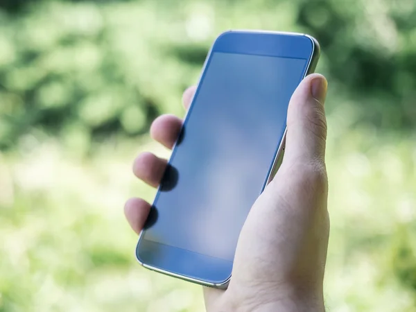 Moderne smartphone in Man's hand — Stockfoto