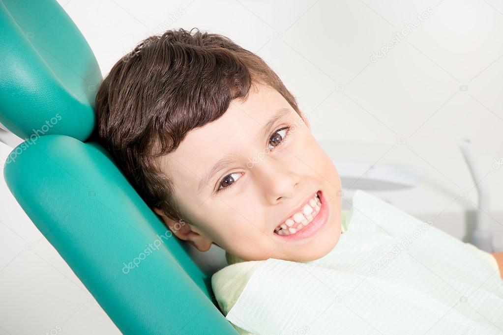 Little kid smiling at dental clinic