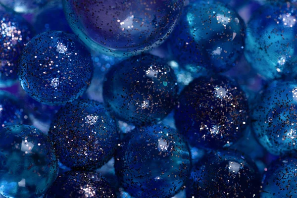 Closeup many transparent balls sprinkled with sparkles. Trendy banner with color of the year 2020 - Classic Blue. — Stock Photo, Image