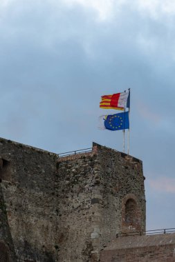 Old castle with waving flags