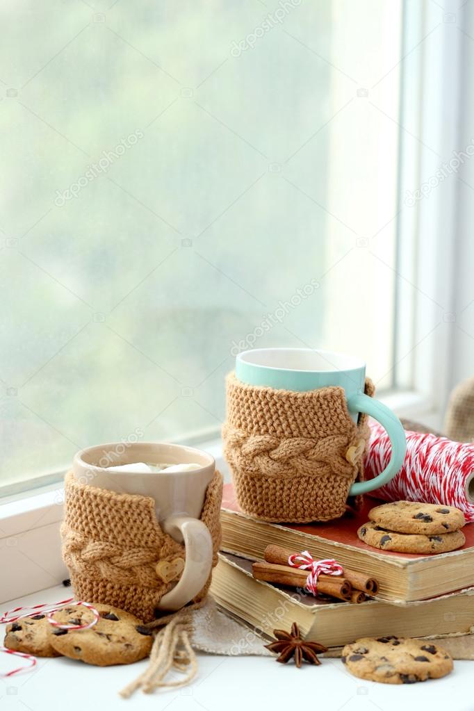 Cup of coffee on windowsill 